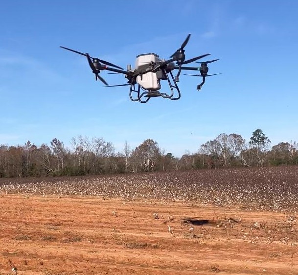 Drone flying above an agricultural field.