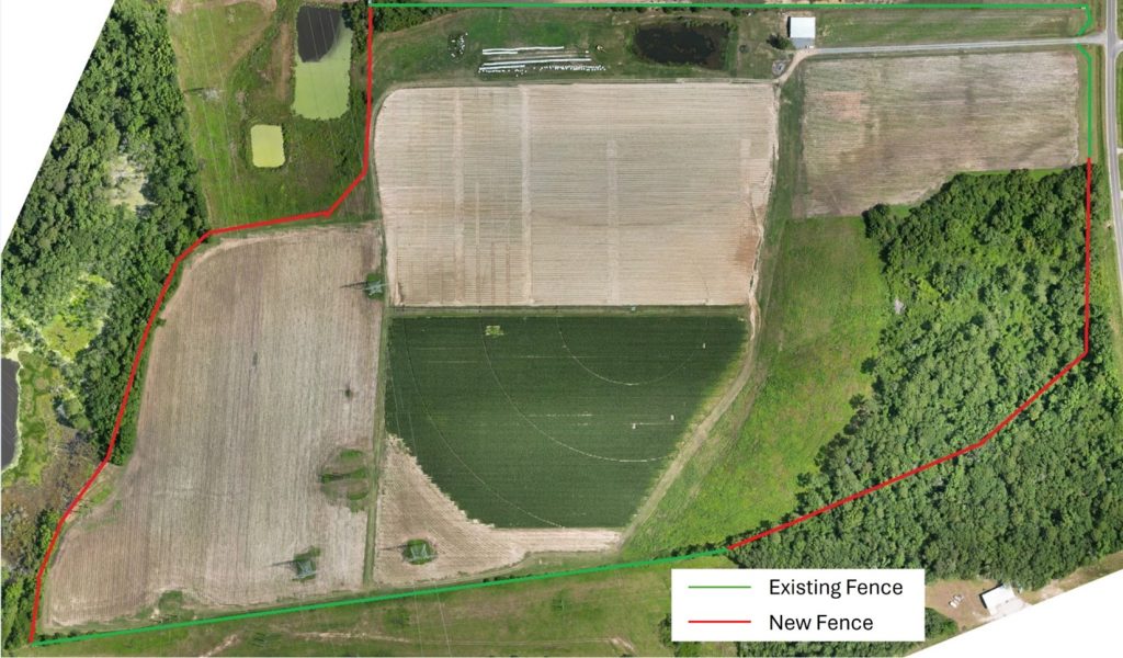 Drone image of the DATA Farm with red and green lines surrounding the farm. The green lines represent existing fencing and are along the northern edge and northeast corner, as well as the southern edge of the farm. The rest of the outline is red, indicating new fencing will be added there.